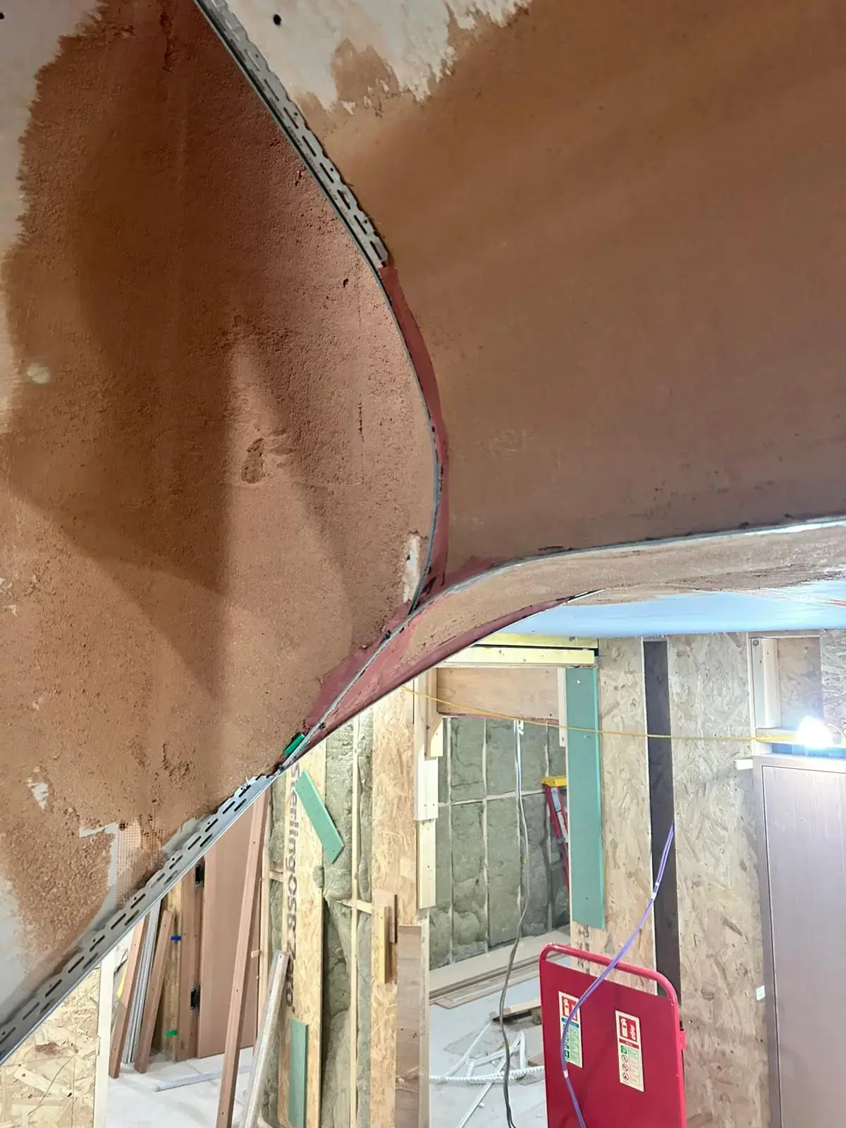 Curved plaster archway transition between rooms