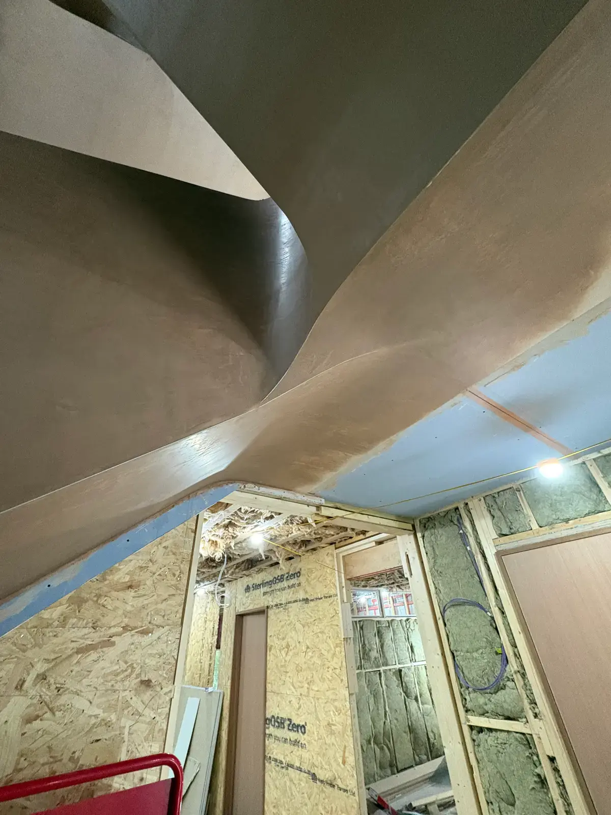 Sculptural curved plaster ceiling drama with timber framing
