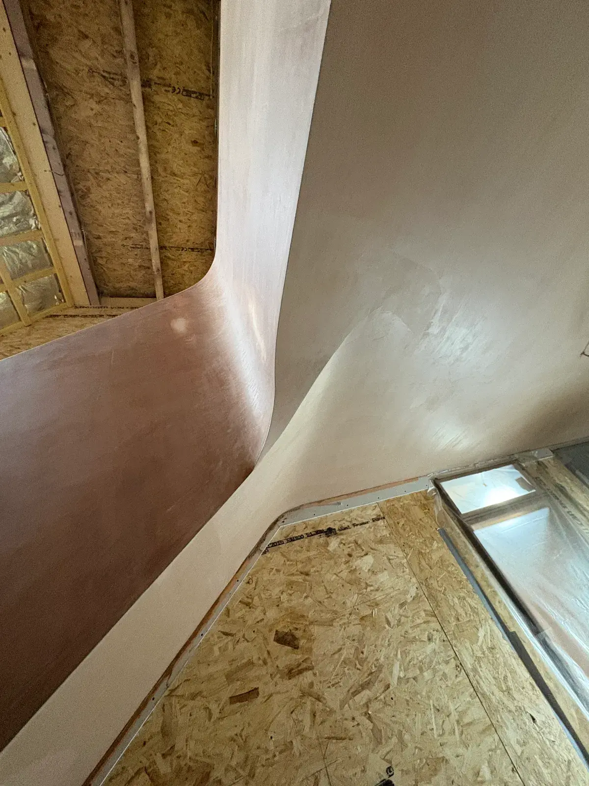 Pearl Plastering curved drylining and skim detail on a Dorset extension staircase