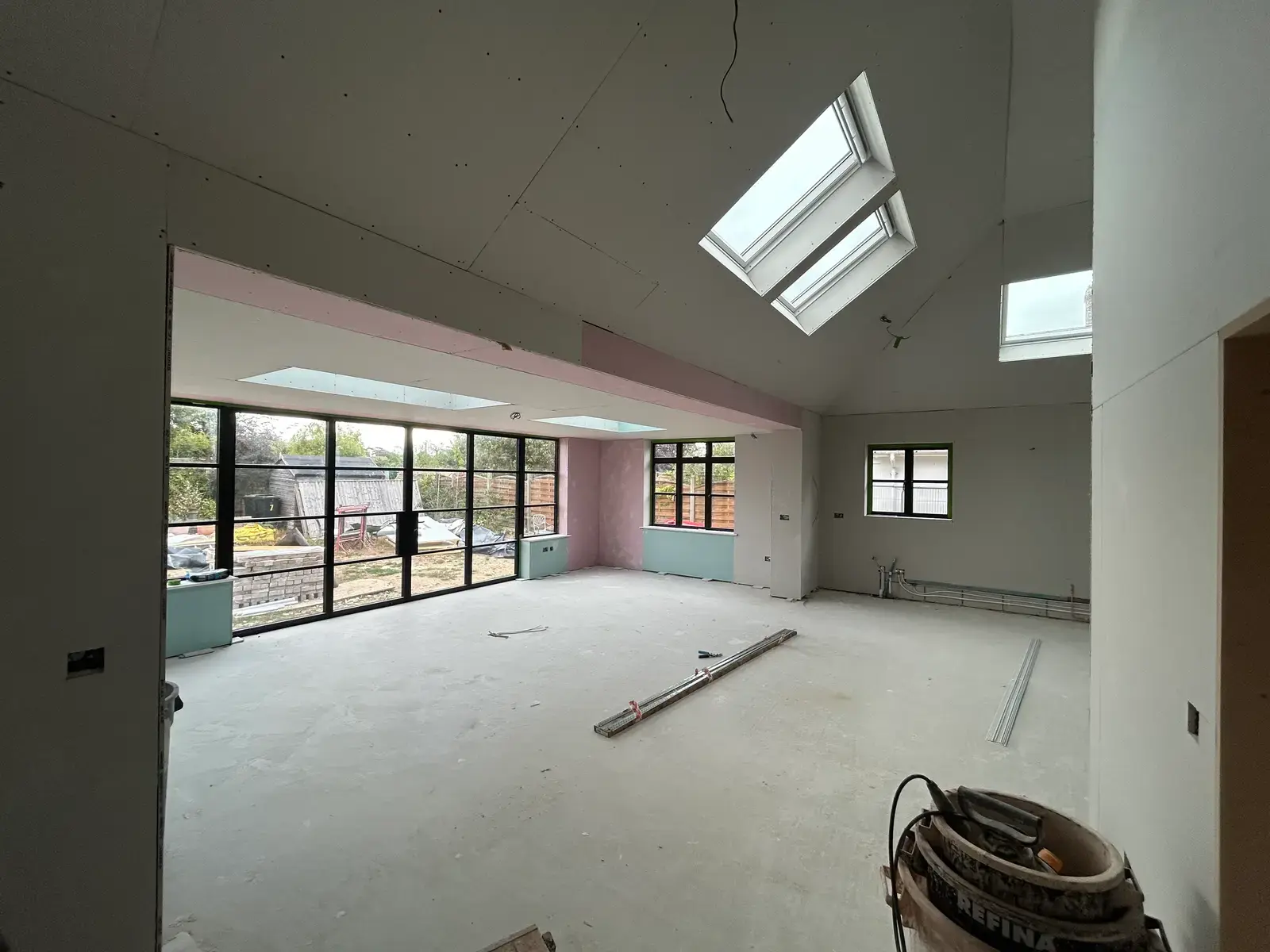 Vaulted extension with twin Velux skylights and full-height glazing