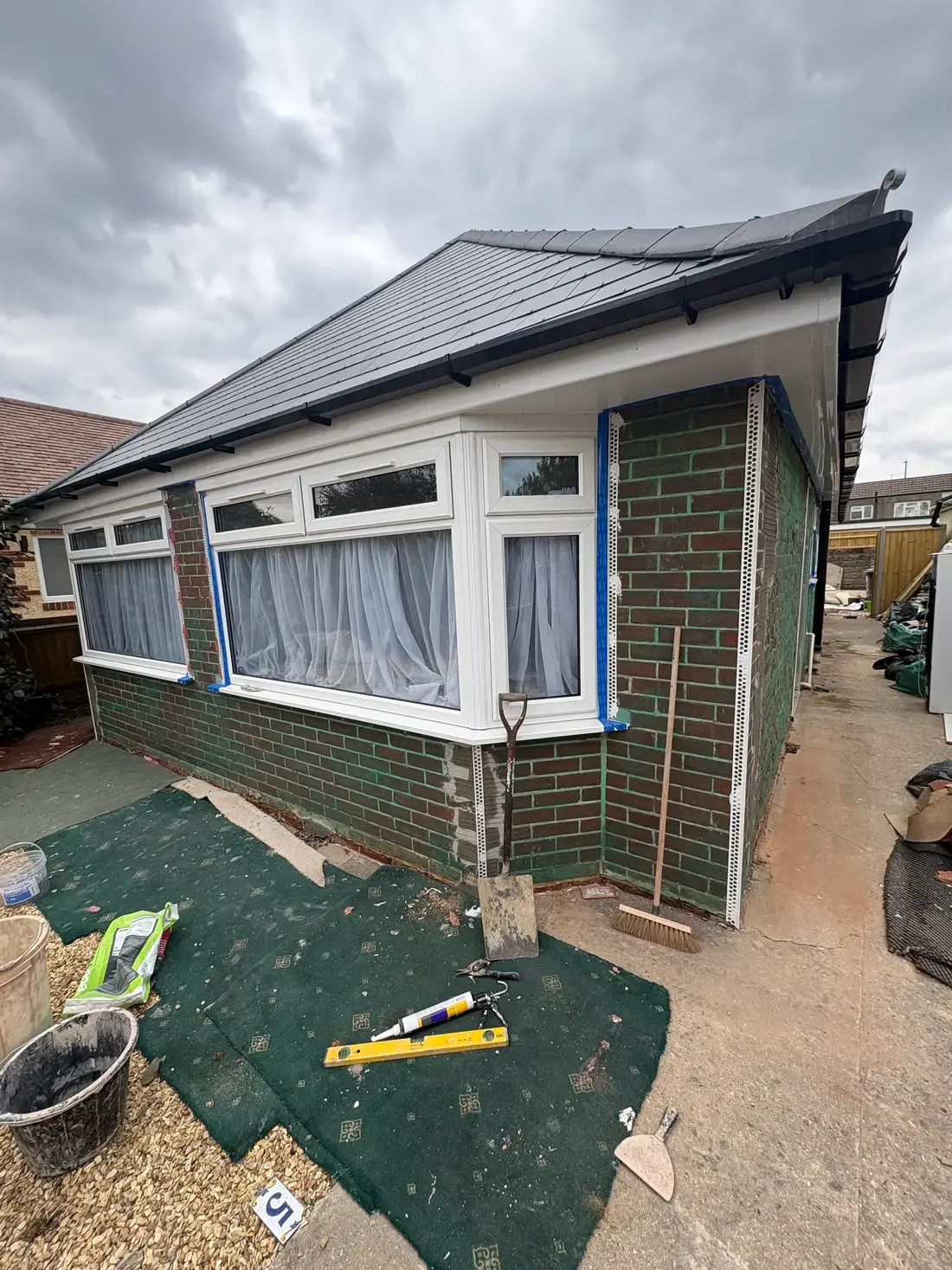 Pre-render preparation, bead corners installed on a brick wall
