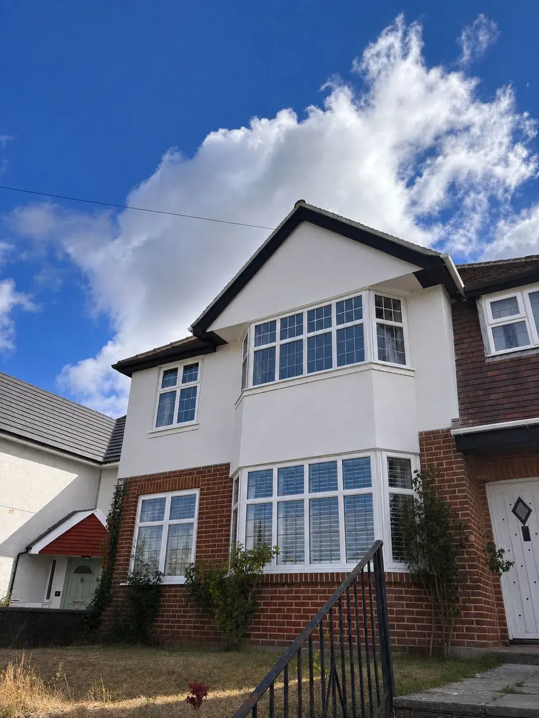 1930s Bournemouth house with the gable and bay freshly rendered white by Pearl