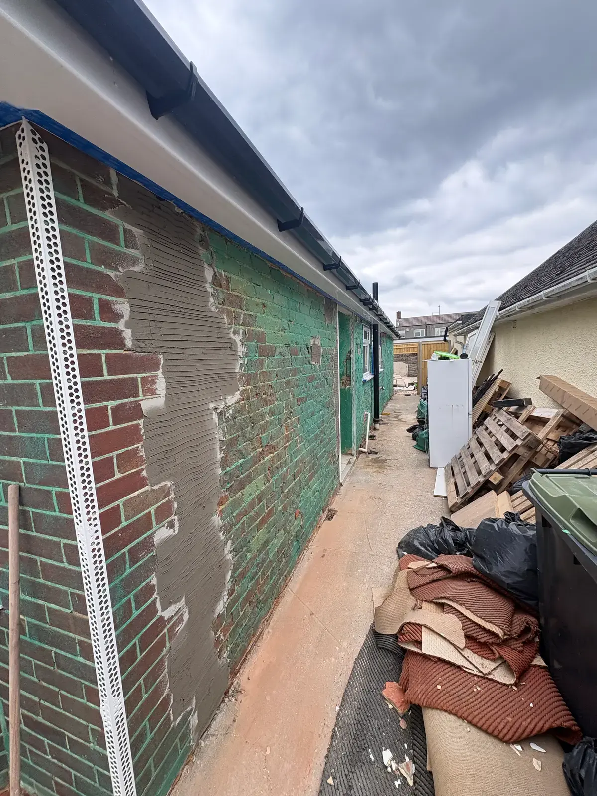 Brick wall masked off with bead corners ready to render