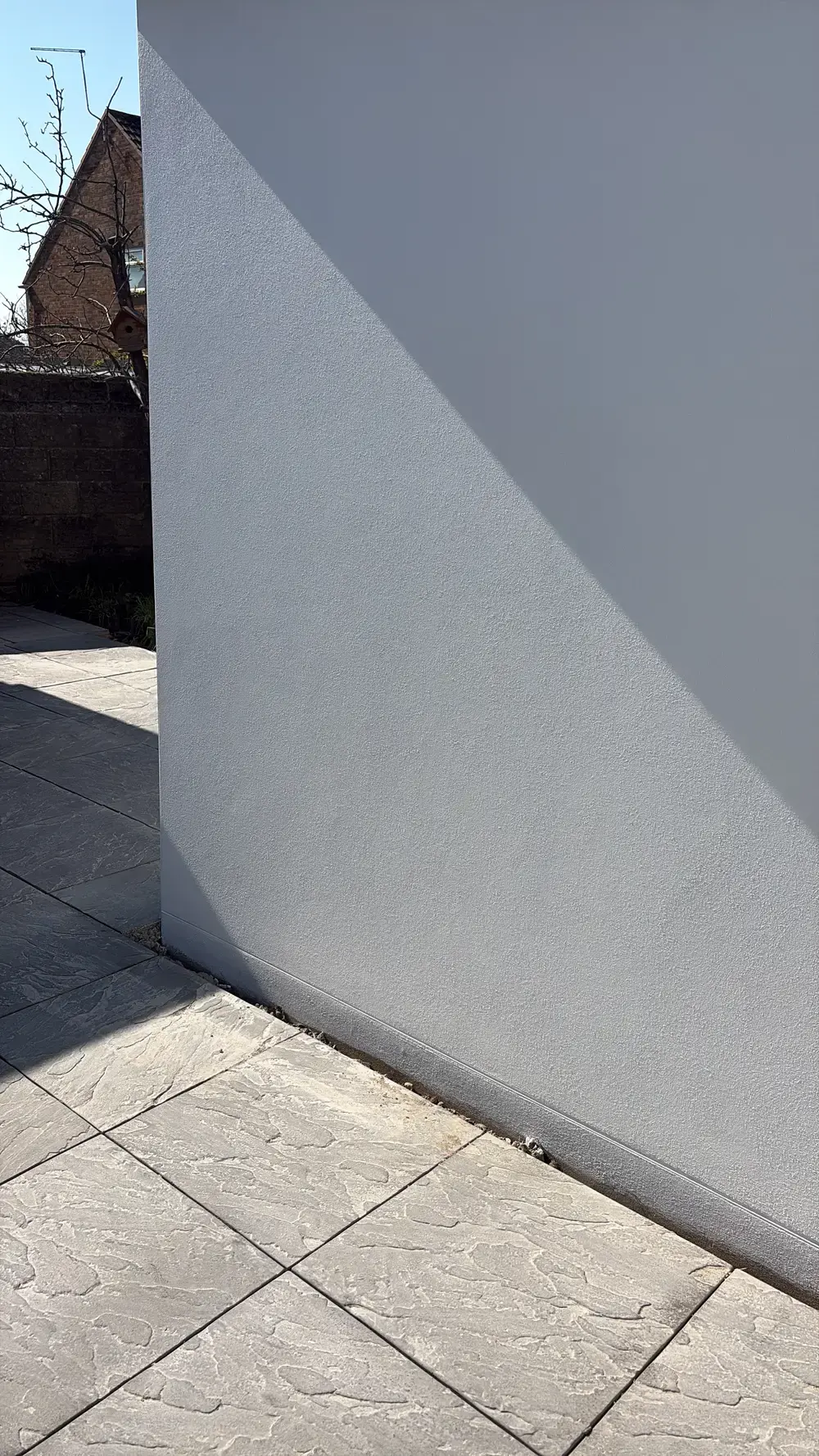 Close-up of a smooth render finish on a Pearl Plastering Dorset job